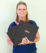 West Hills College District Director of Marketing Amber Myrick with marketing awards.